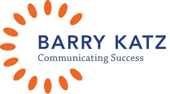 הלוגו מציג את הכיתוב Barry Katz בצבע כחול ומעגל נקודות כתומות